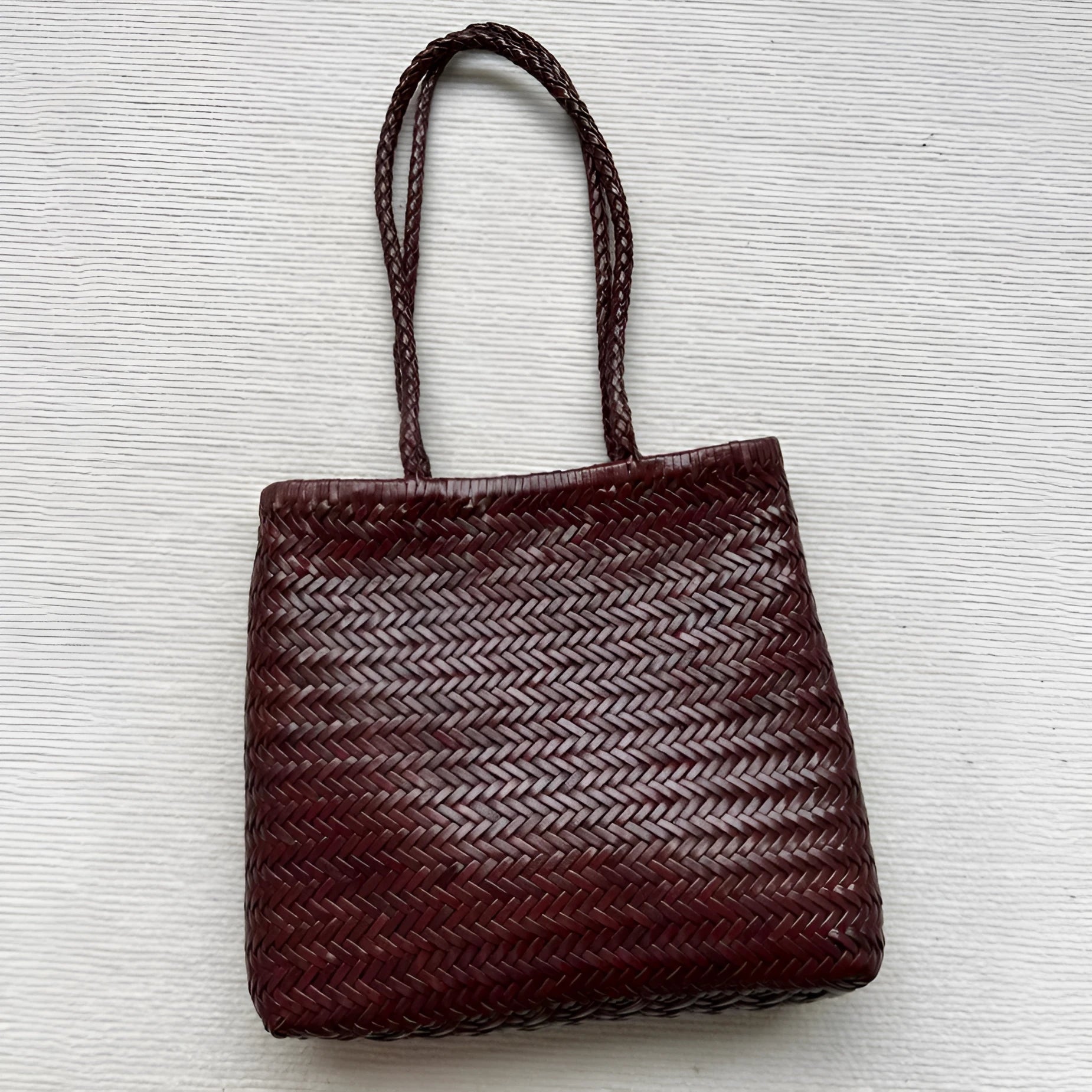 Handmade woven cowhide leather tote bag with three-dimensional pocket in brown colour