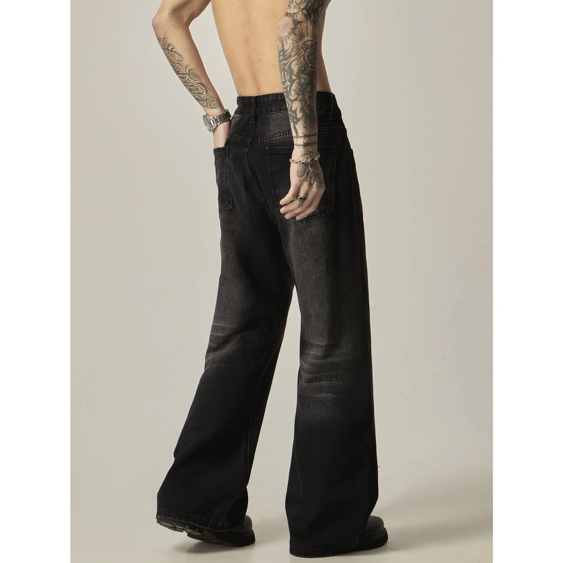 American retro black loose straight-leg jeans with zipper fly on mannequin