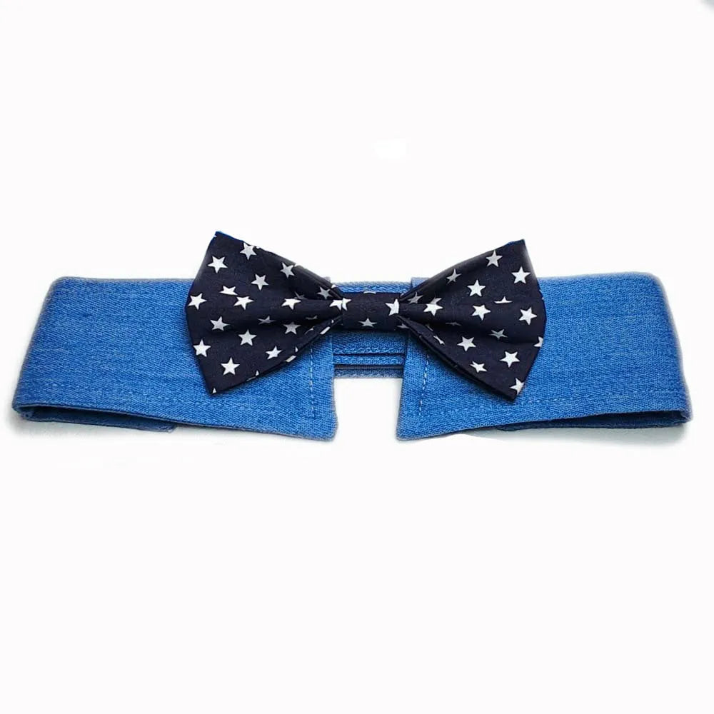 Denim pet collar with star pattern and bow tie on a table, adjustable fastener tape closure