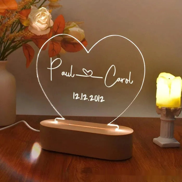 Custom acrylic LED night light with personalised names and dates illuminated