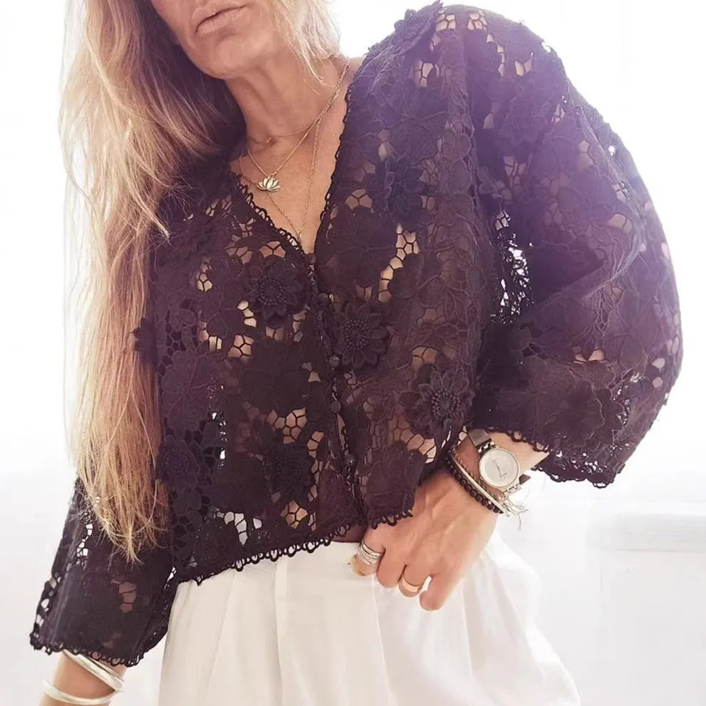 Women's loose black lace cardigan with three-dimensional white floral decoration and a V-neck.