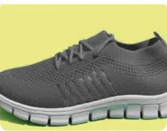 Casual ladies breathable flying knit sports flat shoes in black with mesh upper and front tie closure on foot