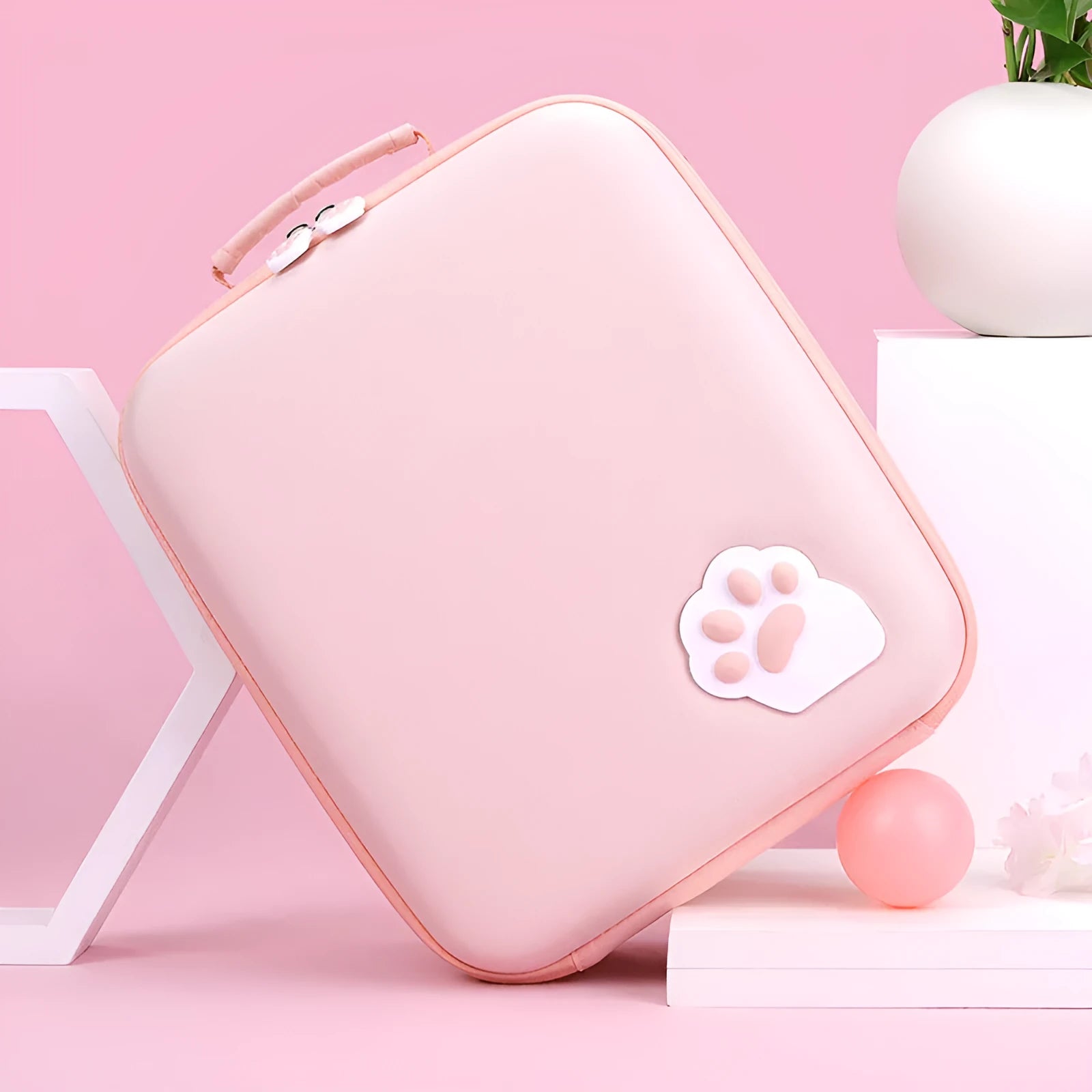 Pink Nintendo Switch storage bag with carry strap, holding game cartridges.