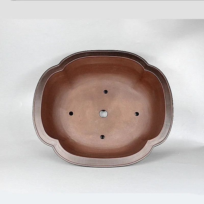 Handmade antique crabapple shaped purple clay flowerpot measuring 74x61x23cm.