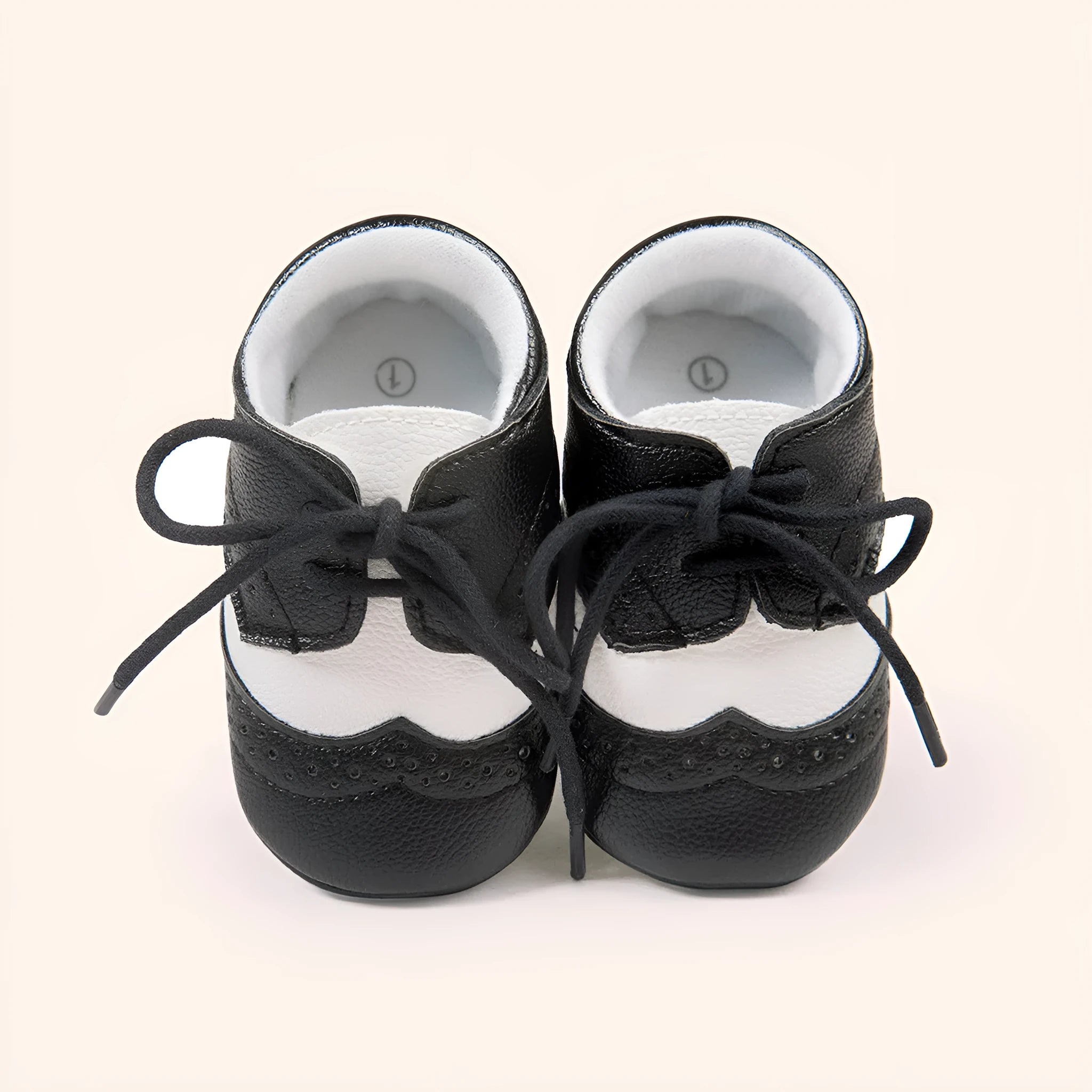 Vintage style baby shoes with soft soles in black synthetic leather