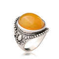 Geometric alloy ring with fluorescent beeswax plating in antique silver amber finish