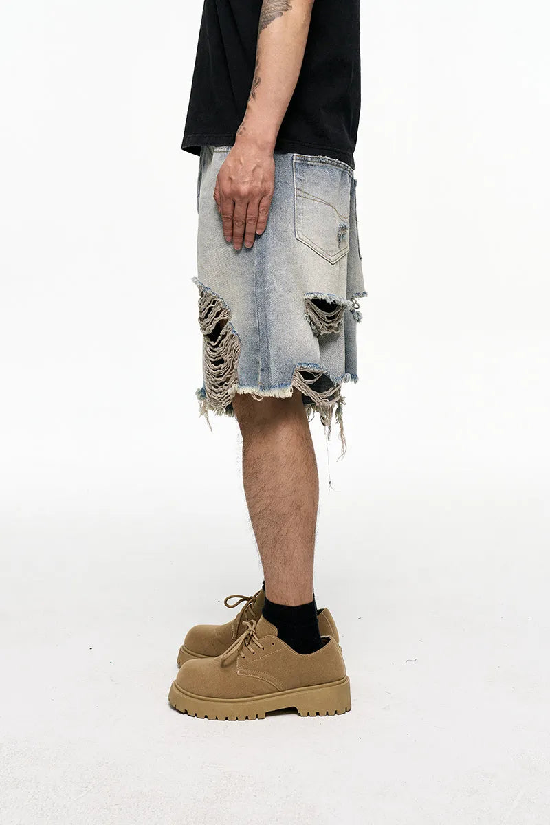 Light blue men's baggy denim shorts with a wide leg and retro washed finish on a mid-waist.