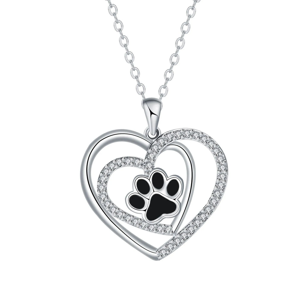 Copper heart pendant necklace with dog paw print detail on a cross chain.