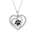 Copper heart pendant necklace with dog paw print detail on a cross chain.