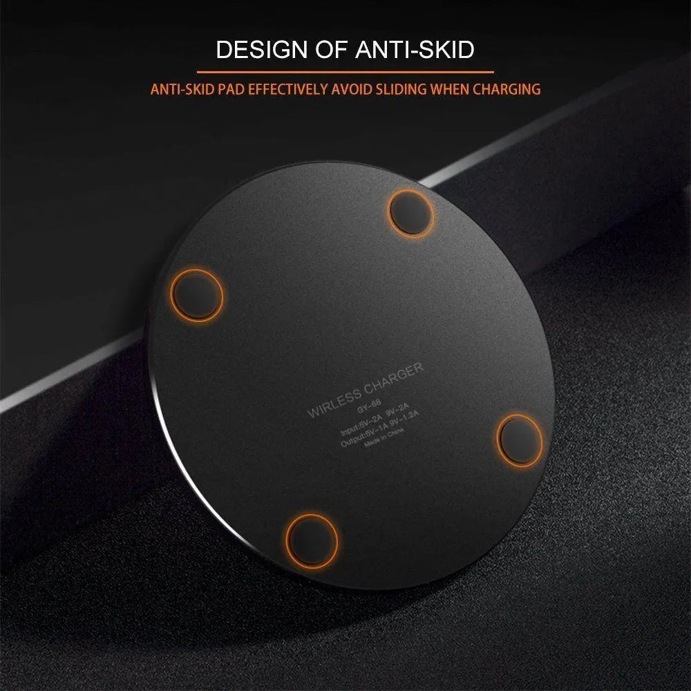 Black square ultra-thin wireless fast charger with USB cable on a desk