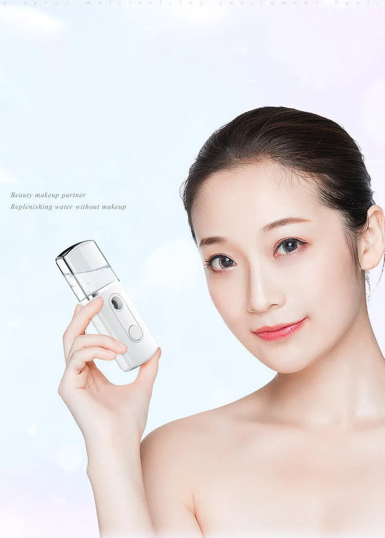 Portable facial nano mist humidifier in white, 10cm long, with 20ml water tank and USB cable
