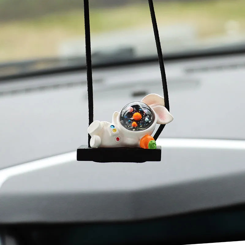 Resin astronaut car pendant with hand-painted cartoon designs in five colour variations