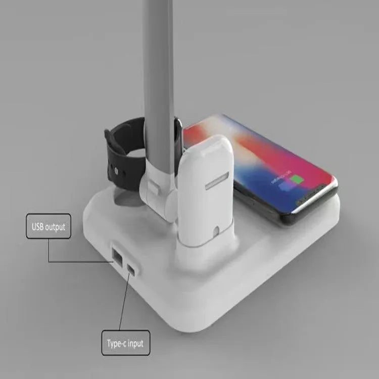 Black and white 4-in-1 multifunction LED desk lamp with wireless charging pad and USB port.
