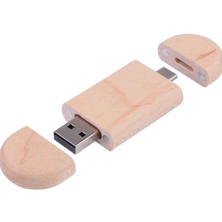 Maple wooden USB flash drive with Type-C connector on a wooden surface.