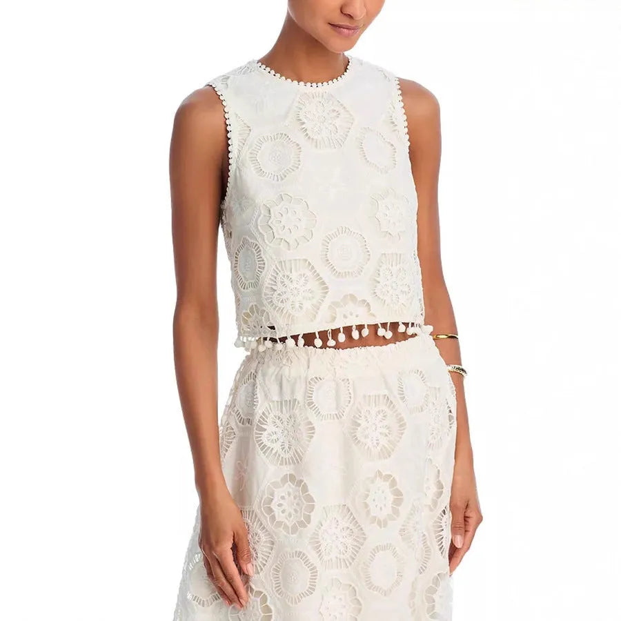 White polyester women's suit set with sleeveless top and long skirt featuring retro embroidery
