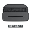 Black leather car seat rear storage bag showing its box shape and size against a vehicle seat.