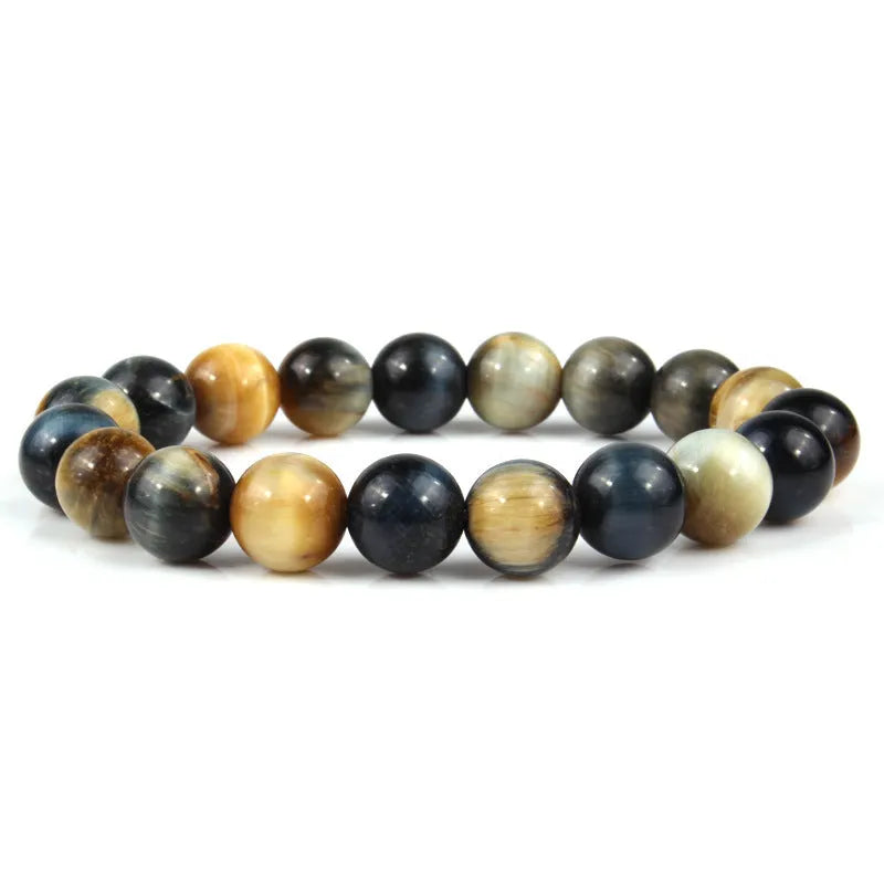 Natural tigereye crystal bracelet with round geometric beads on a wrist