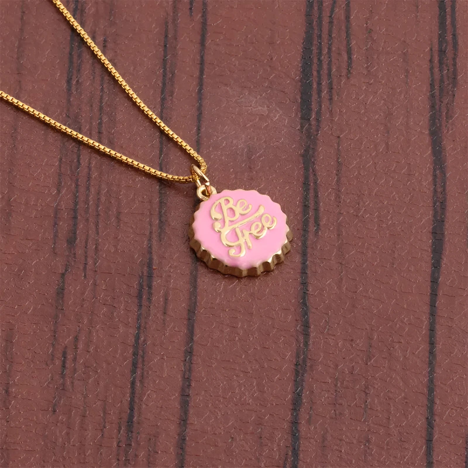 Copper bottle cap pendant necklace with gold plating on a 40cm box chain in various colours.