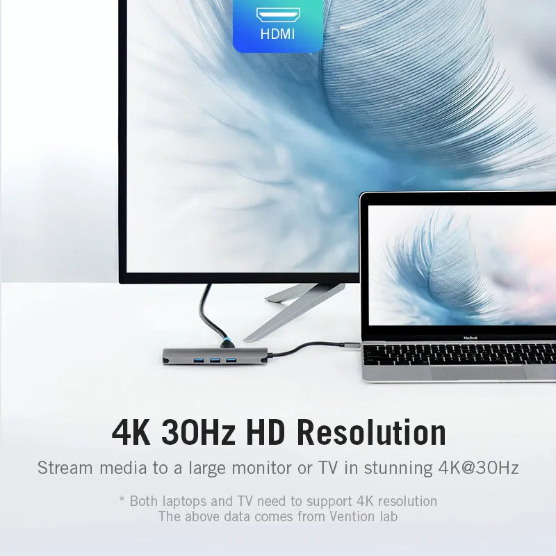 Deep grey Type-C hub with HDMI, USB, Ethernet, and memory card ports on a compact aluminium body.