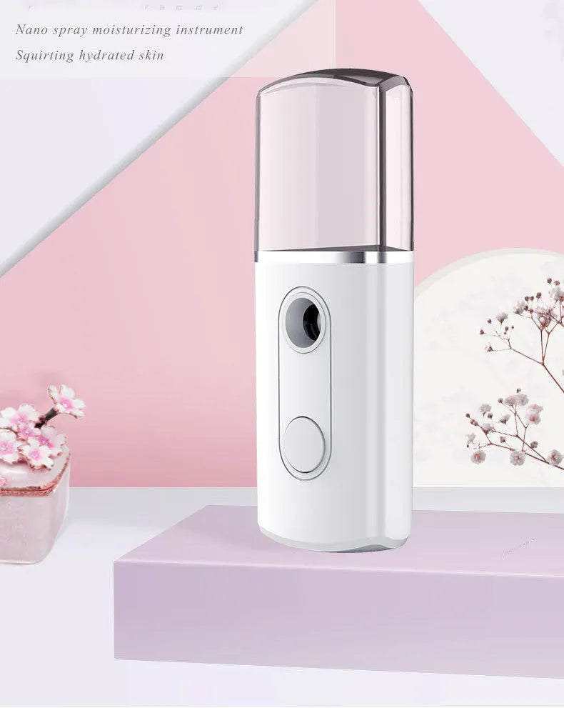 Portable facial nano mist humidifier in white, 10cm long, with 20ml water tank and USB cable