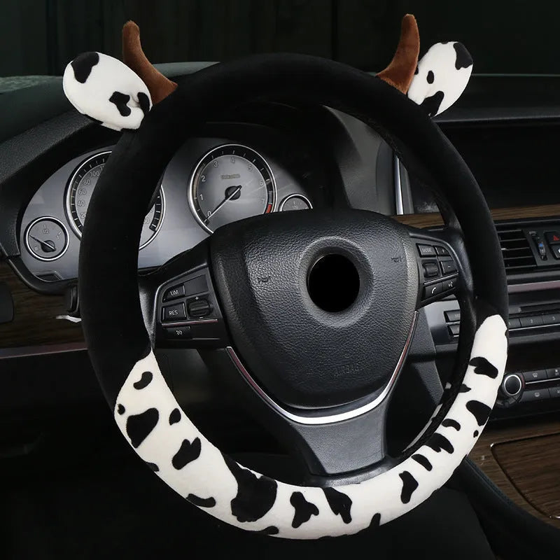 Short plush steering wheel cover for cars in black colour showing textured surface