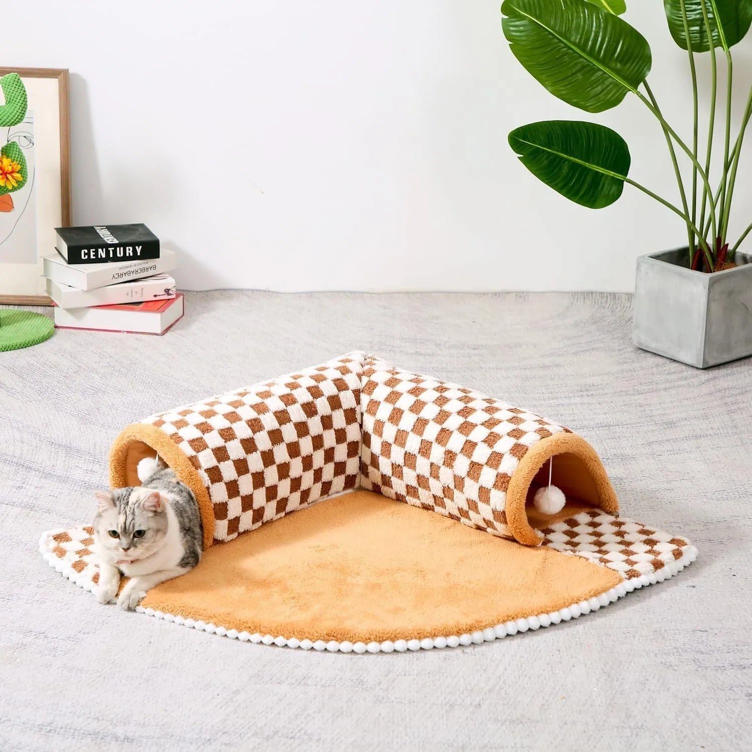 Coffee-coloured plush pet bed with attached tunnel showing soft sleeping area and play space