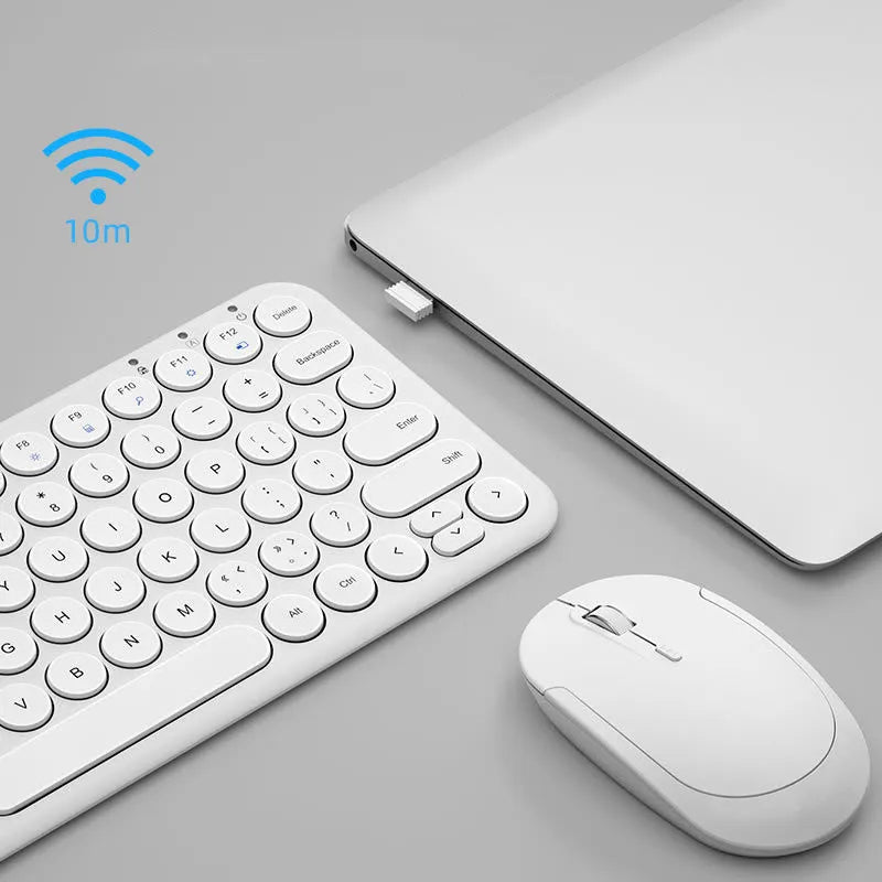 Ultra-thin wireless keyboard and optical mouse set on desk with USB receiver