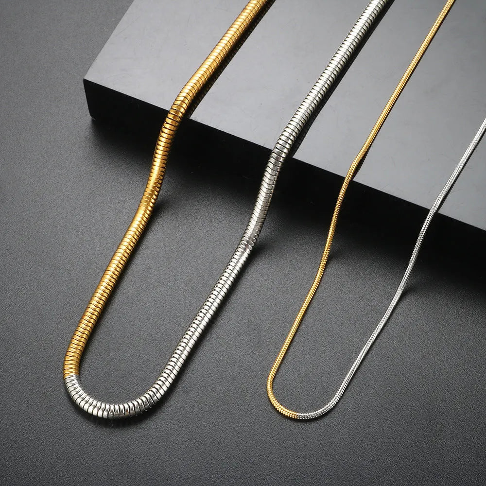 Gold-coloured stainless steel snake bone chain necklace with a 3mm width and geometric design.