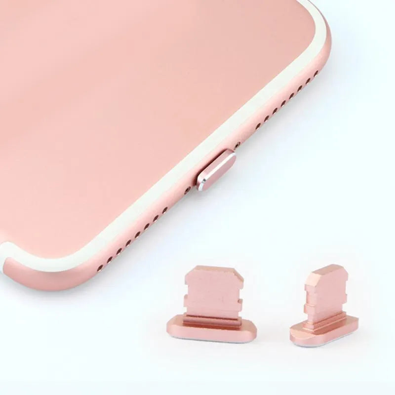 Aluminium alloy iPhone charging port dust plug in various colours on a white background.