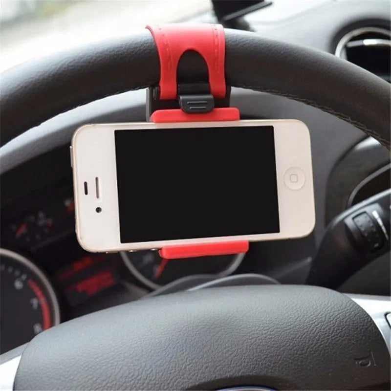 Black steering wheel phone clip holder mounted on car steering wheel