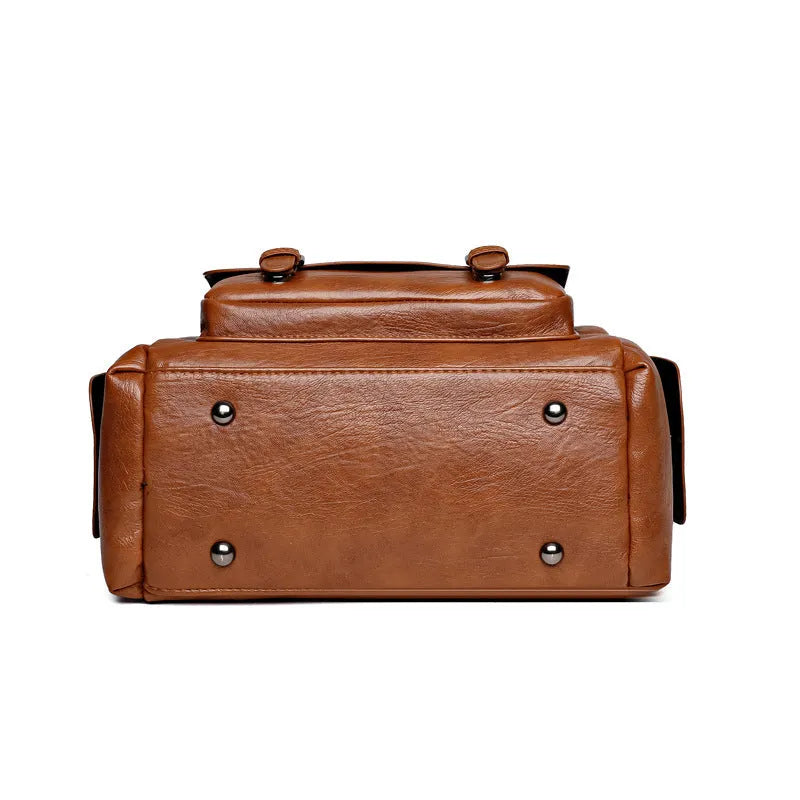 Horizontal square vintage messenger bag in PU leather with contrast stitching, shown in multiple colours.
