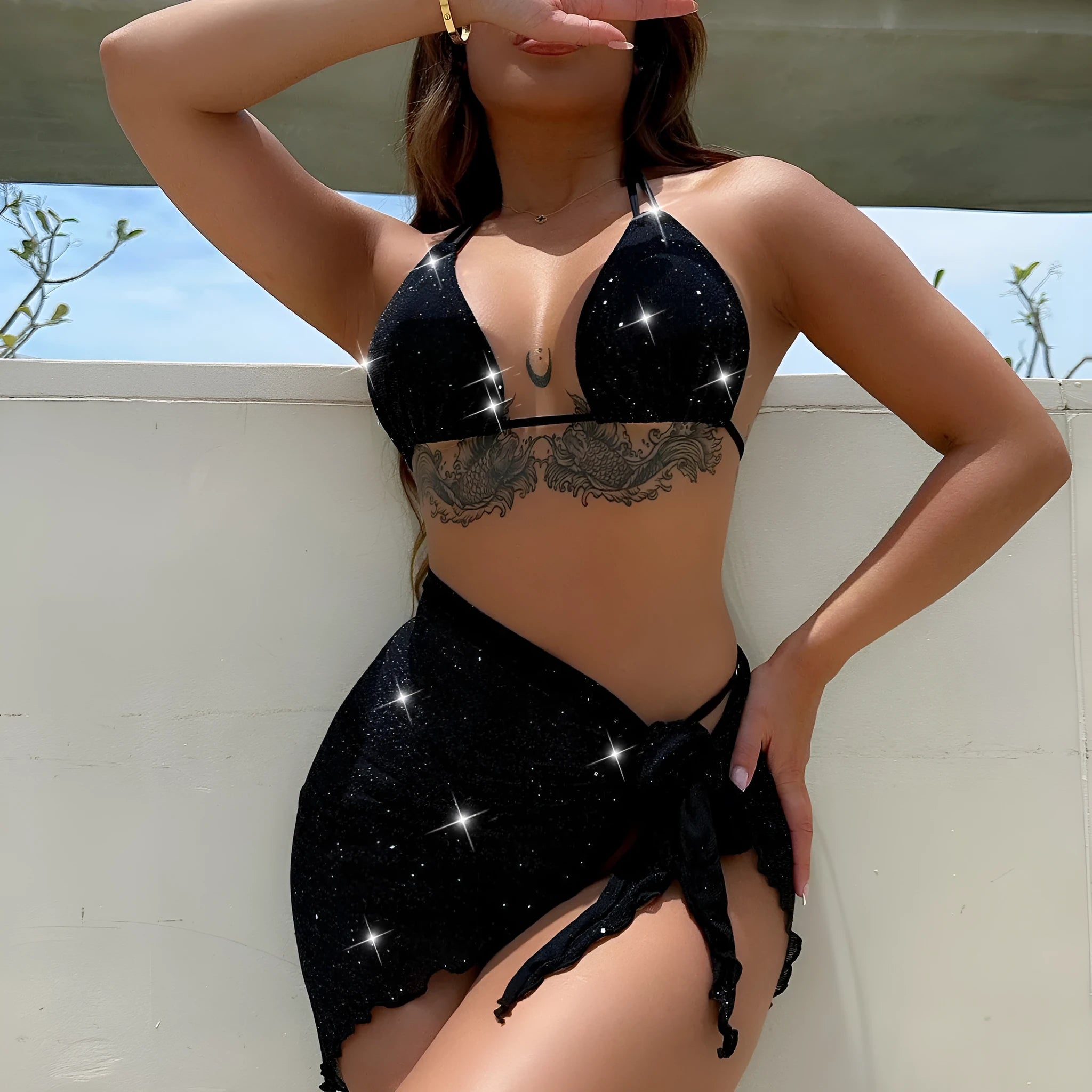 Black three-piece bikini swimsuit set with separate top and shorts