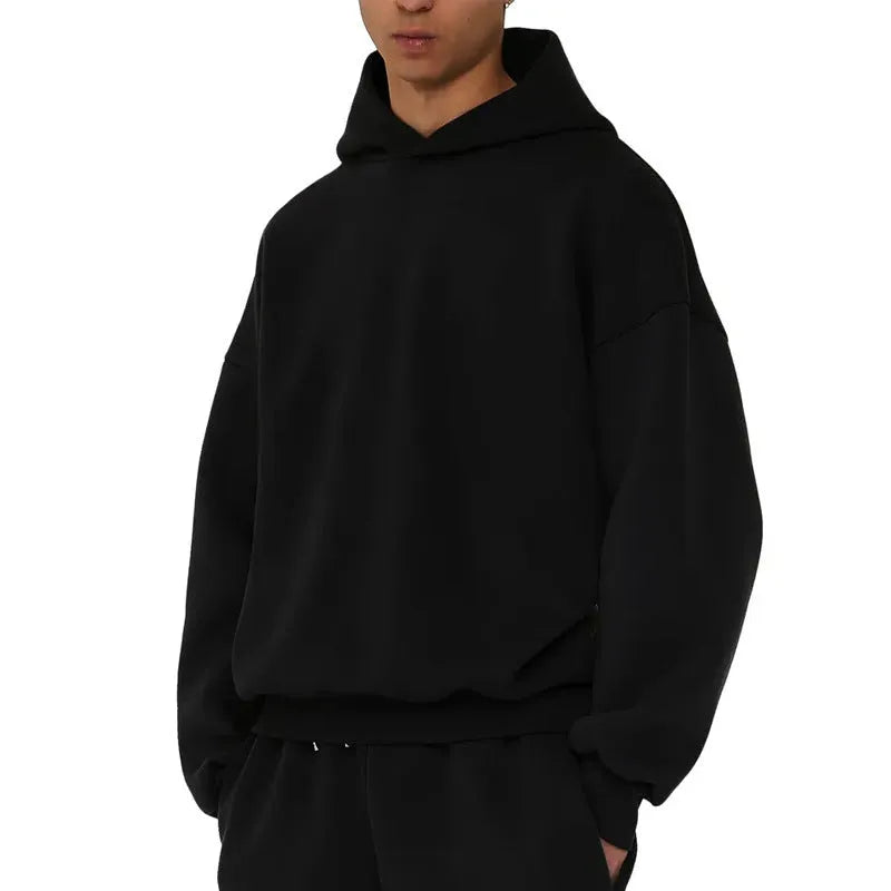 Man wearing a solid-colour fleece-lined cotton hoodie with wool lining.