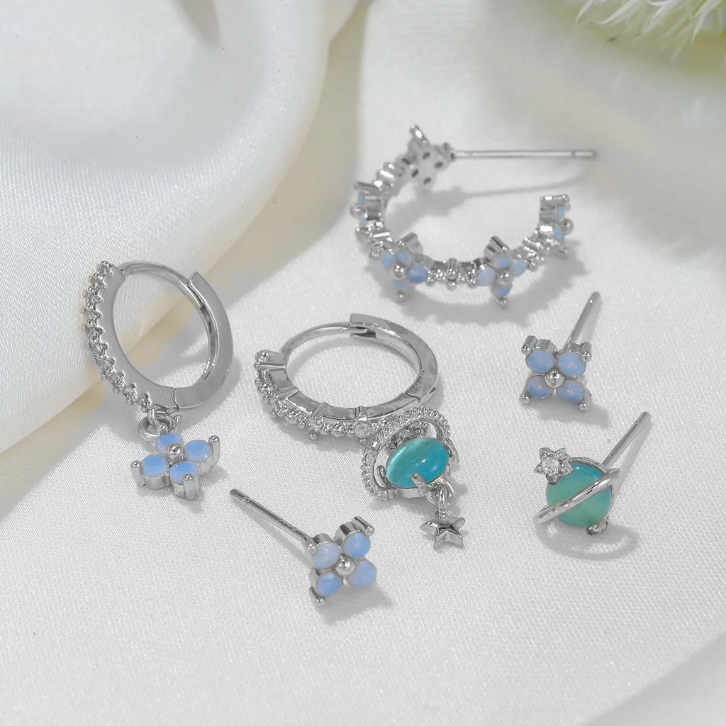 Gold and silver Japanese Korean style flower earrings studs with blue zircon mosaic detail.
