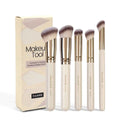 Five angled makeup brushes with apricot handles for powder, foundation and blush application