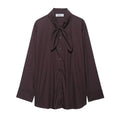Women's brown loose-fit long sleeve poplin shirt with attached scarf bow tie, front view