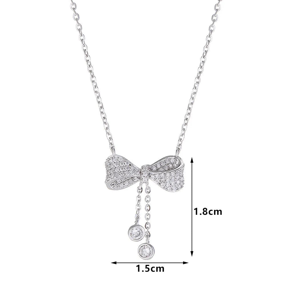 925 sterling silver necklace with a bow pendant on a silver O-ring chain.