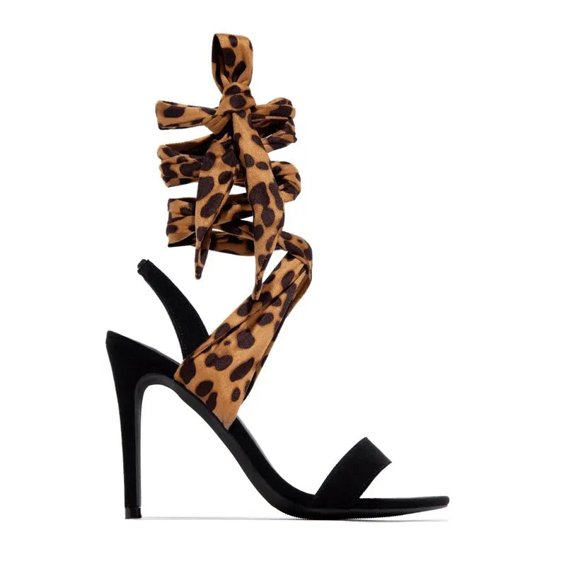 Light brown women's high heel sandals with leopard print, cross straps, and a thin high heel