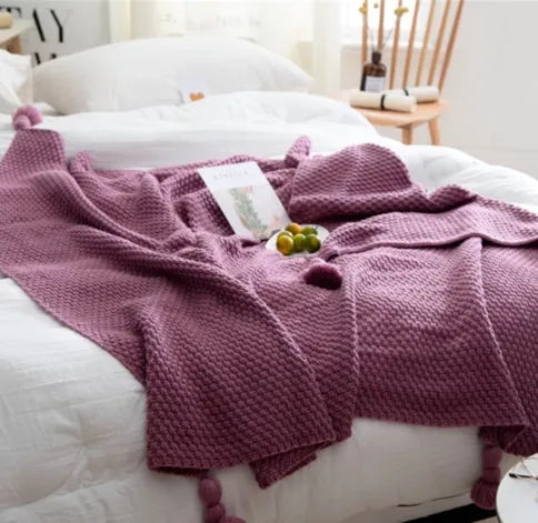 Acrylic knit ball blanket in beige colour, measuring 130 by 170 centimetres, laid flat.