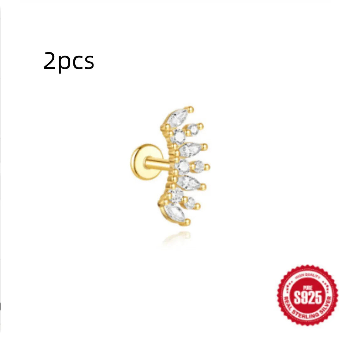 Close-up of a geometric water drop shaped earring in S925 sterling silver with a flat spiral puncture detail.