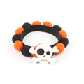 Halloween pet fur ball collar in pumpkin orange colour with fluffy ball on a black collar