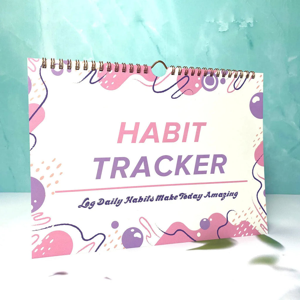 English habit tracking book open showing pages, 21cm by 28cm in flower white colour