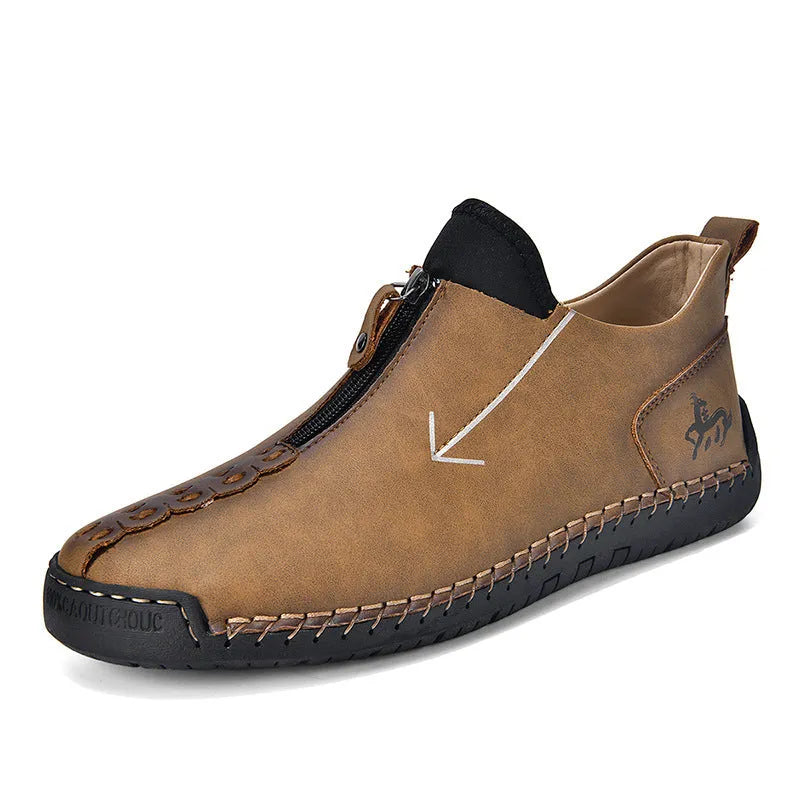 Men's black leather boots with front zipper and hand-stitched detailing on round toe