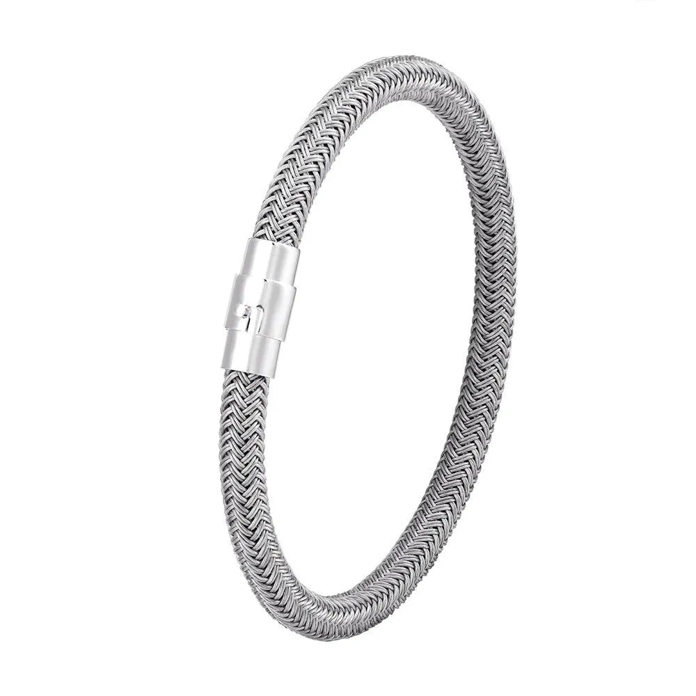 Geometric titanium steel bracelet with magnetic clasp shown in a unisex style on a wrist.