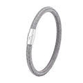 Geometric titanium steel bracelet with magnetic clasp shown in a unisex style on a wrist.
