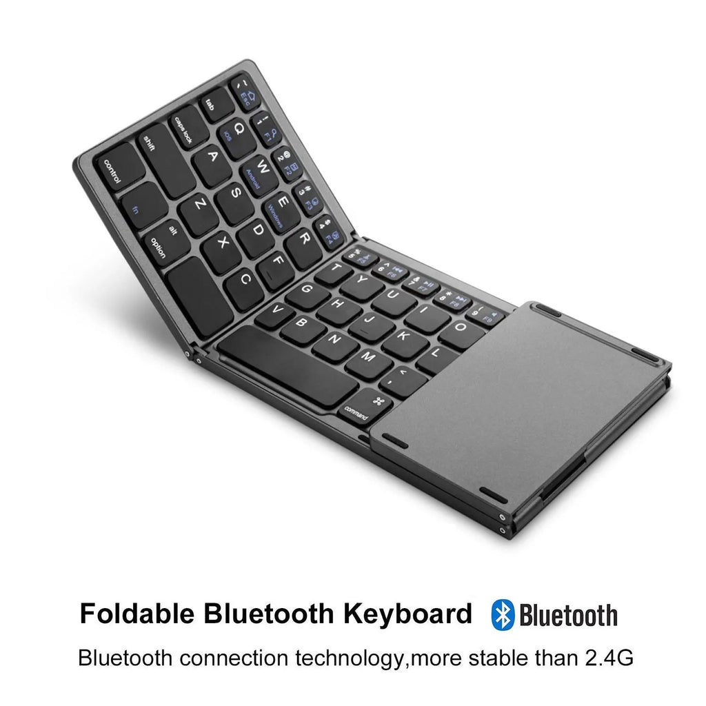 Black tri-fold Bluetooth keyboard shown open next to a tablet and folded in hand.