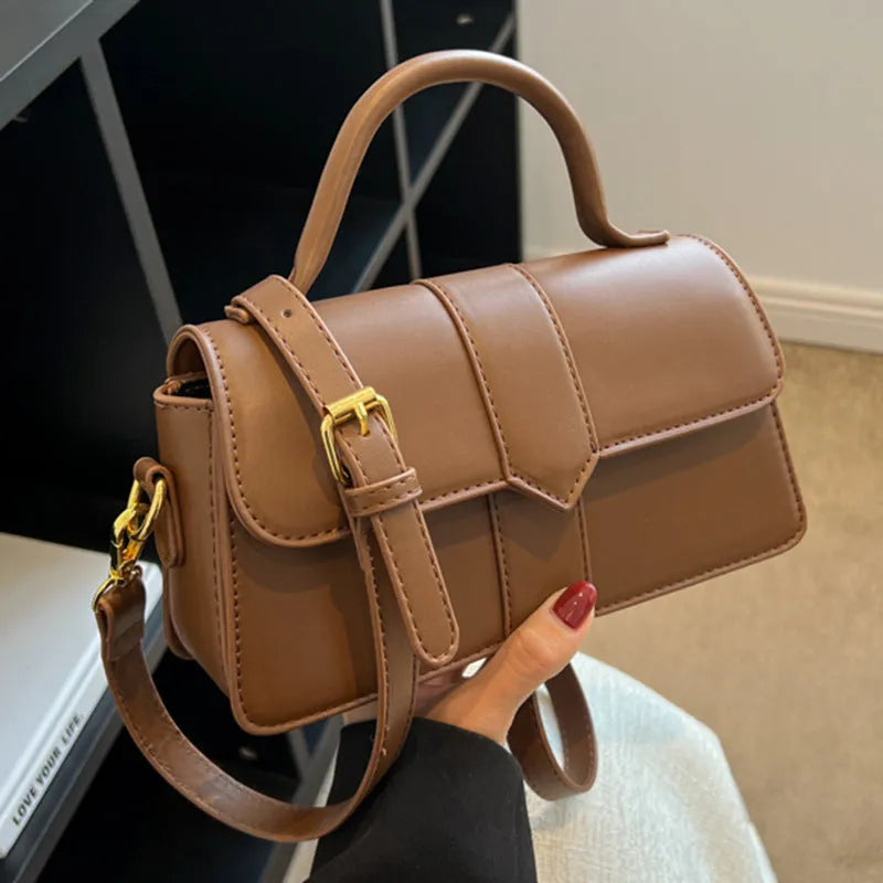 Women's beige messenger bag with horizontal square design showing external pockets and 22cm width
