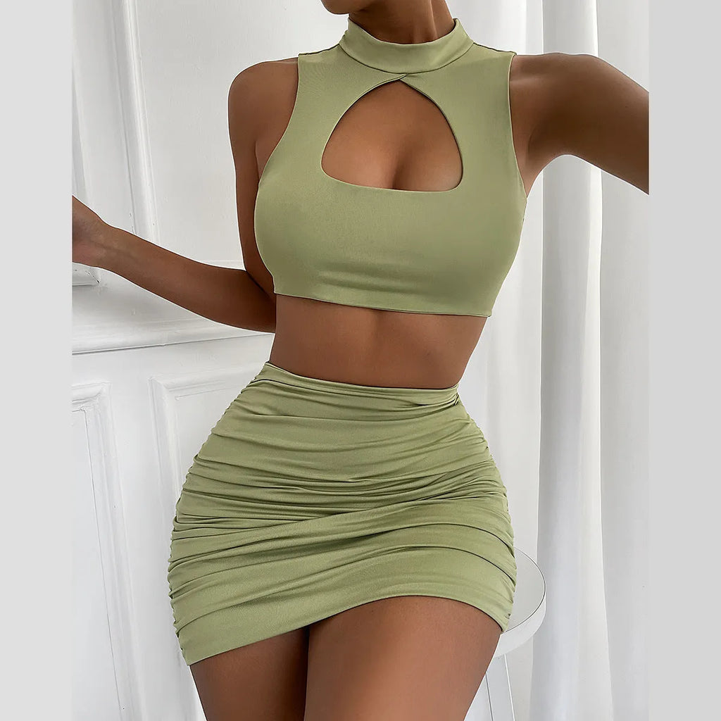 Light purple women's hollow vest and split skirt two-piece summer outfit set.