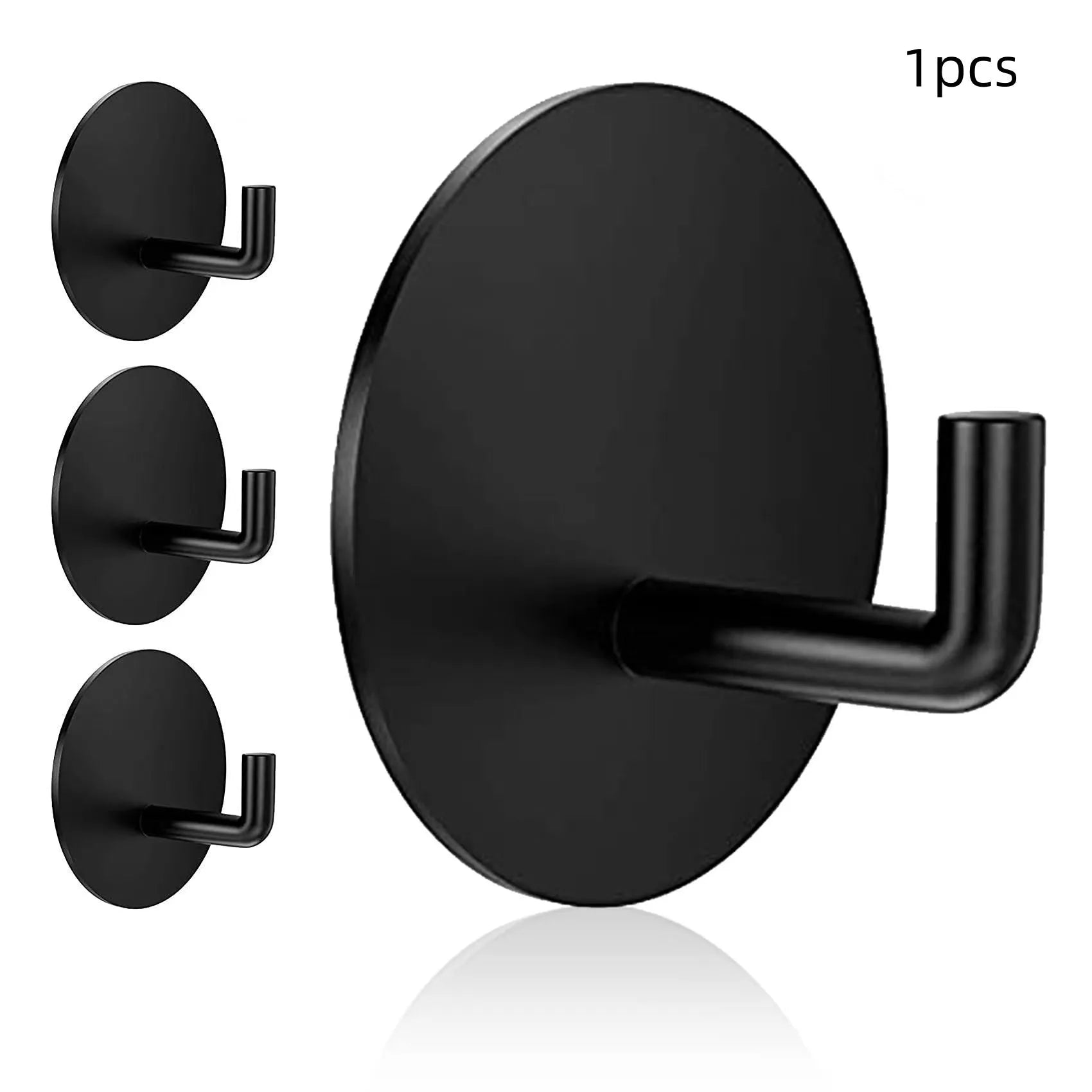 Two round stainless steel self-adhesive hooks, one black and one sanded polished, on a white background.