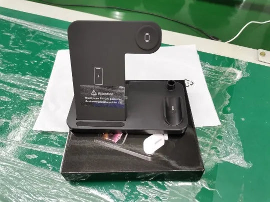 Folding 4-in-1 wireless charger showing multiple charging pads in open position with smartphone placement